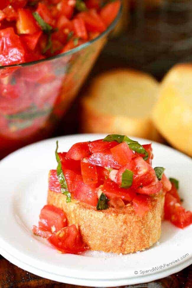 Garden Fresh Bruschetta on top of bread on a white plate