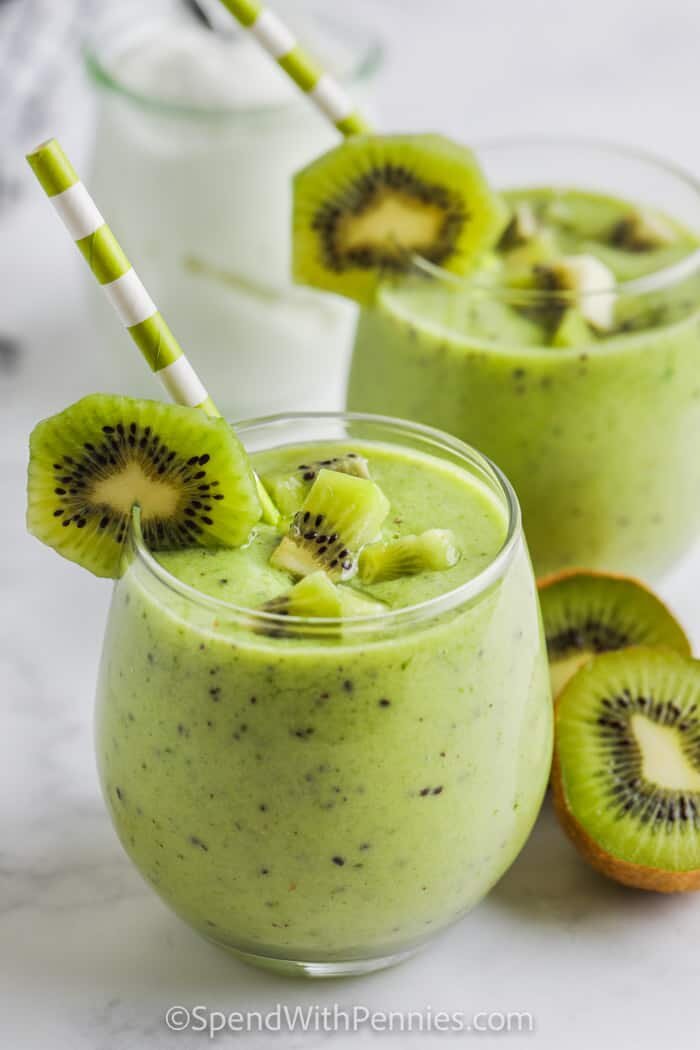 Kiwi Smoothie in a glass with pieces of kiwi as garnish