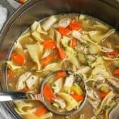 pot of Classic Chicken Noodle Soup with a ladle