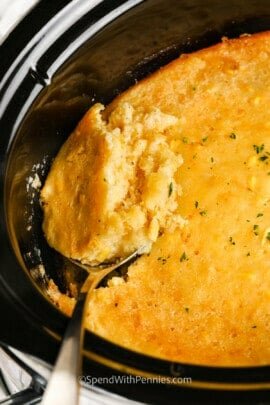 taking a spoonful of Crockpot Corn Casserole