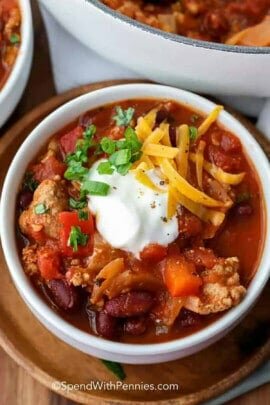 close up of Turkey Chili with sour cream and cheese on top