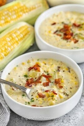 bowls of Easy Homemade Corn Chowder with a spoon